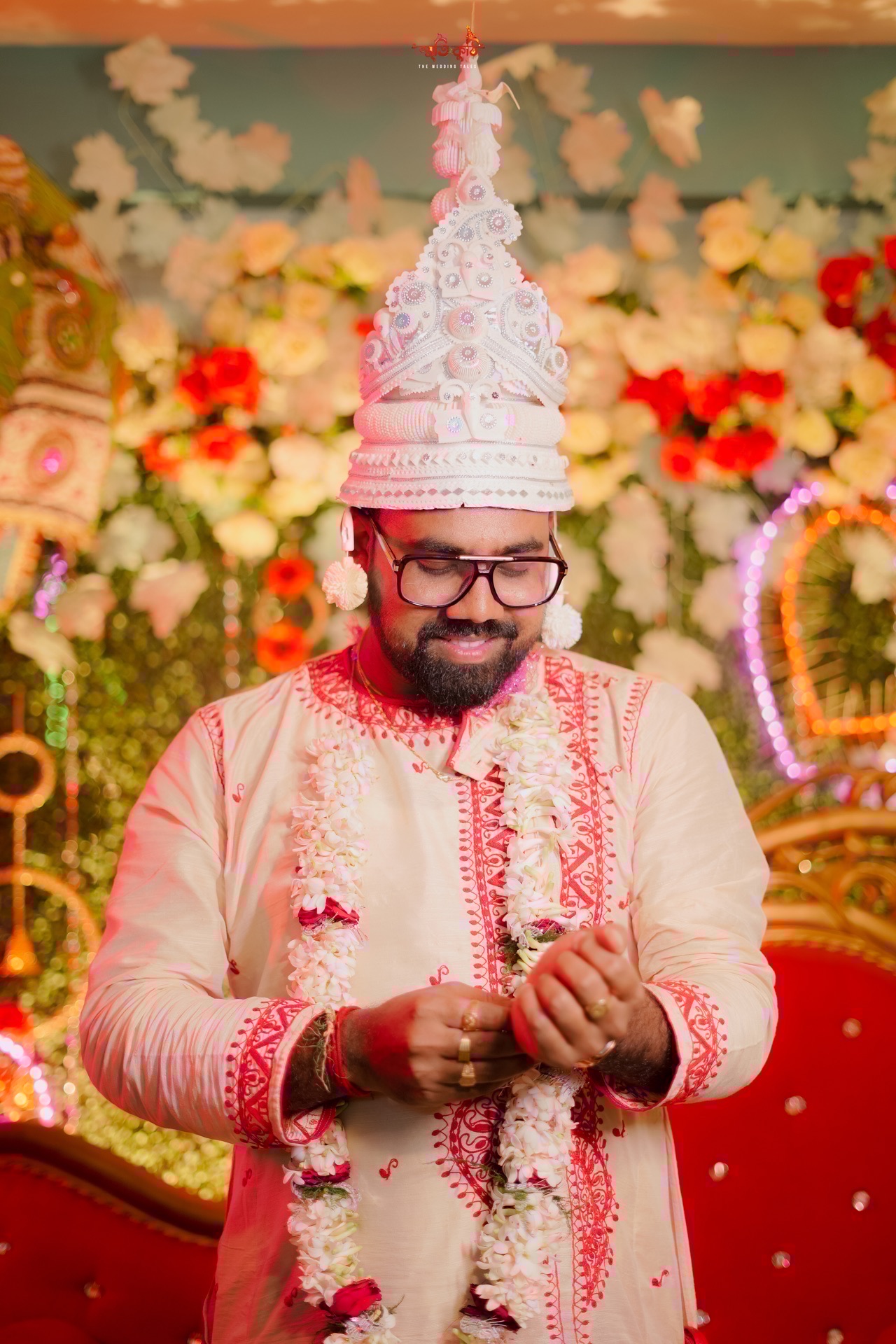 Bengali Groom Anirban wearing Topor during wedding ceremony