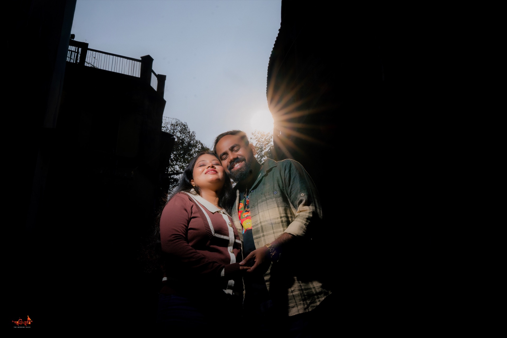 Anirban & Debapriya sunburst silhouette over Kolkata skyline