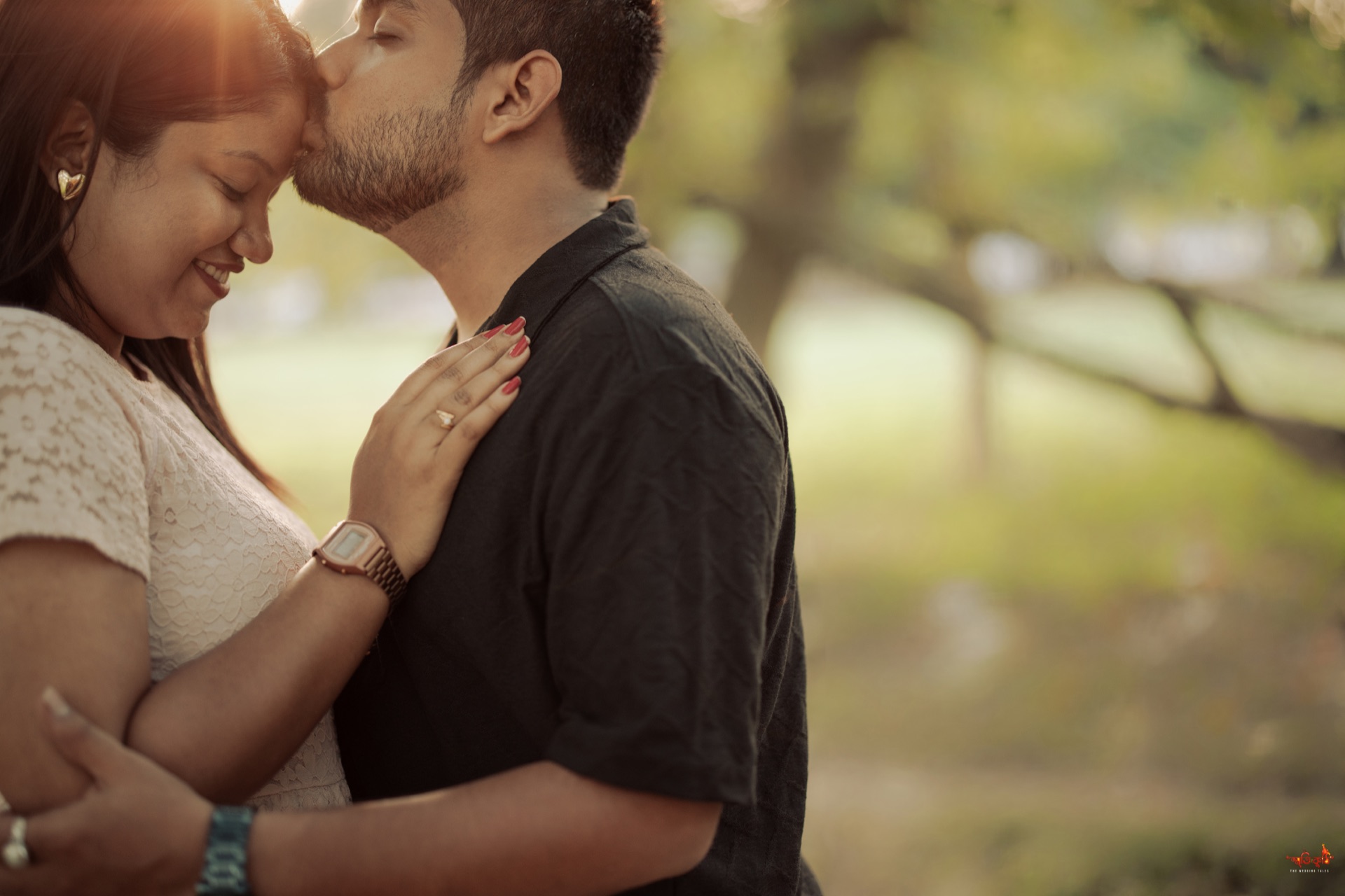 Sourin & Sharmistha golden hour forehead kiss in nature